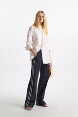 Dorothee Schumacher Wide Leg Track Pants with Knit Side Stripes in Navy Vancouver. Shop Online or in Store.