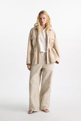 Dorothee Schumacher Waterproof Hooded Shrug in Light Sand Vancouver. Shop Online or in Store.