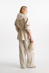 Dorothee Schumacher Waterproof Hooded Shrug in Light Sand Vancouver. Shop Online or in Store.