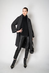 Amina Rubinacci Relaxed Fit Knit Wool Turtleneck in Black Vancouver. Shop Online or in Store.