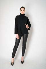 Amina Rubinacci Relaxed Fit Knit Wool Turtleneck in Black Vancouver. Shop Online or in Store.