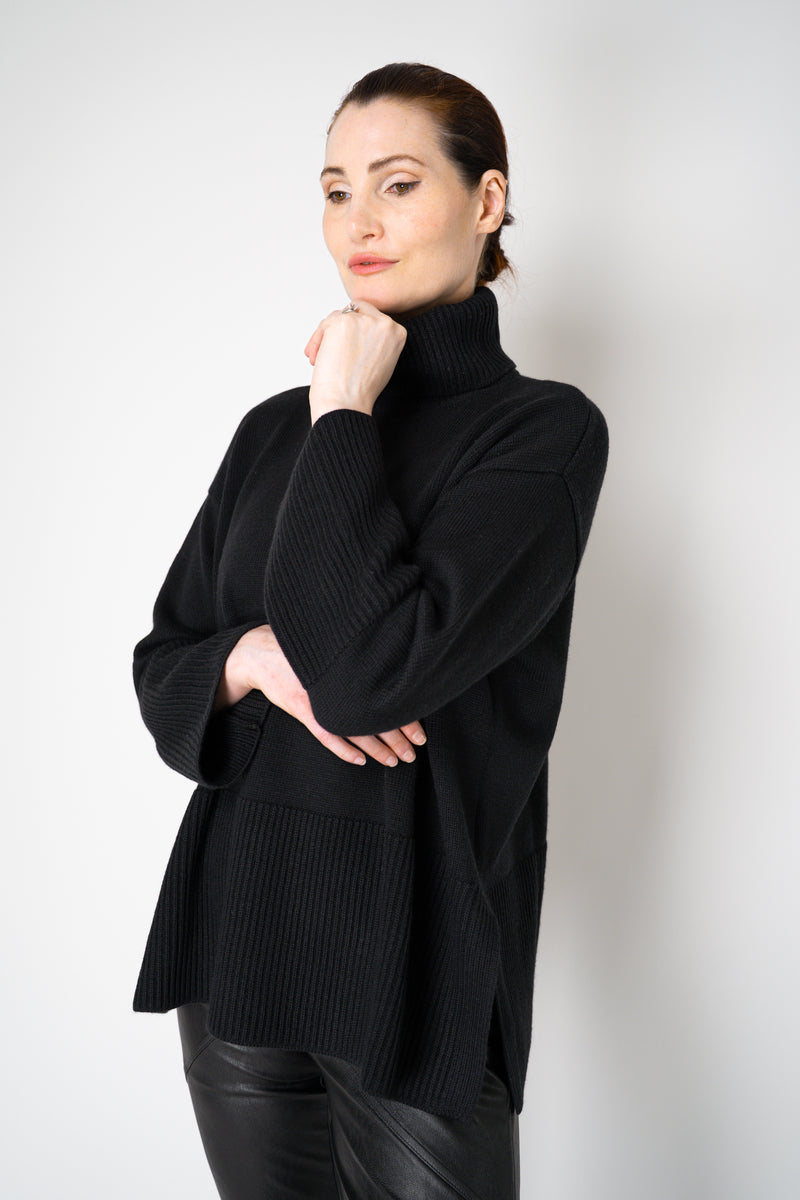 Amina Rubinacci Relaxed Fit Knit Wool Turtleneck in Black Vancouver. Shop Online or in Store.