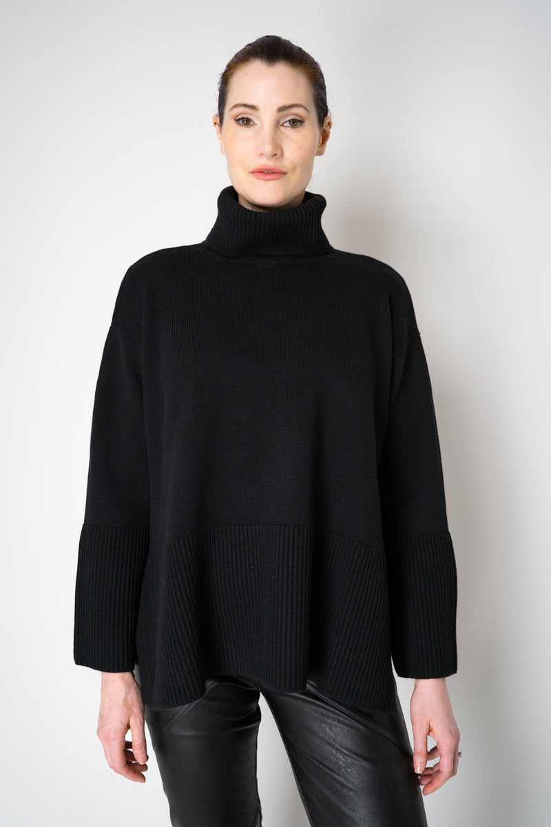 Amina Rubinacci Relaxed Fit Knit Wool Turtleneck in Black Vancouver. Shop Online or in Store.