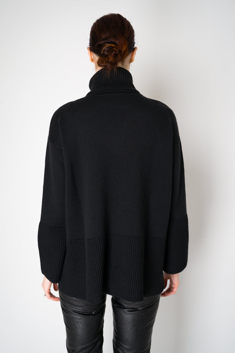 Amina Rubinacci Relaxed Fit Knit Wool Turtleneck in Black Vancouver. Shop Online or in Store.