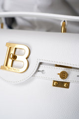 Balmain B-Buzz 23 Grained Leather Bag in White Vancouver. Shop Online or in Store.
