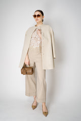 D. Exterior Cropped Wide Leg Linen Trousers with Beaded Cuffs in Blush Beige Vancouver. Shop Online or in Store.