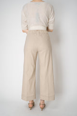 D. Exterior Cropped Wide Leg Linen Trousers with Beaded Cuffs in Blush Beige Vancouver. Shop Online or in Store.