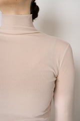 D. Exterior Stretch Tulle Turtleneck Top in Nude Pink Vancouver. Shop Online or in Store.