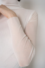 D. Exterior Stretch Tulle Turtleneck Top in White Vancouver. Shop Online or in Store.