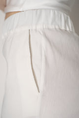 D. Exterior Tapered Leg Linen Trousers with Brilliant Beading Pockets in White Vancouver. Shop Online or in Store.