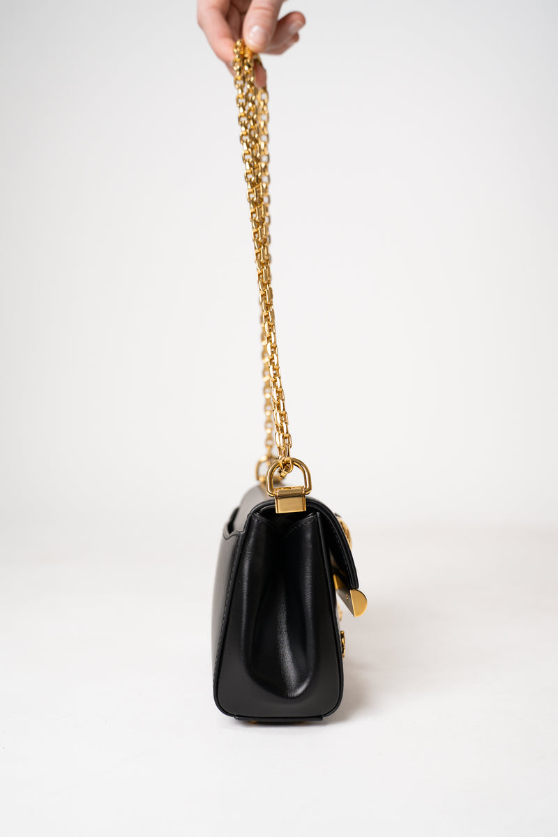 Dolce & Gabbana Mini Marlene City Bag with Gold Charms in Black Vancouver. Shop Online or in Store.