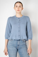 Dorothee Schumacher Cropped Round Neck Cardigan with Flounce Hem in Blue Vancouver. Shop Online or in Store