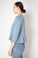 Dorothee Schumacher Cropped Round Neck Cardigan with Flounce Hem in Blue Vancouver. Shop Online or in Store