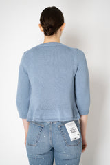 Dorothee Schumacher Cropped Round Neck Cardigan with Flounce Hem in Blue Vancouver. Shop Online or in Store
