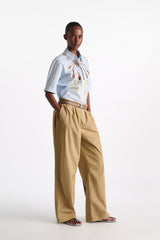 Dorothee Schumacher Garment Washed Cotton Poplin Pleated Pants in Brown Vancouver. Shop Online or in Store.
