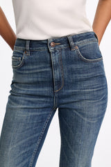 Dorothee Schumacher Mid Rise Flared Jeans in Mid Dark Blue Vancouver. Shop Online or in Store.