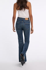 Dorothee Schumacher Mid Rise Flared Jeans in Mid Dark Blue Vancouver. Shop Online or in Store.