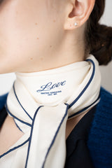 Dorothee Schumacher Silk "Love" Scarf with Navy Blue Trim in White Vancouver. Shop Online or in Store