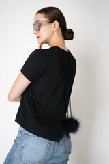Dorothee Schumacher Stretch Cotton T-shirt with Back Pompom Detail in Black Vancouver. Shop Online or in Store