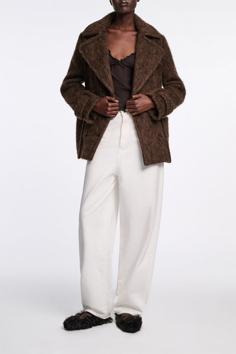 Dorothee Schumacher Tapered Leg Mid Rise Baggy Jeans in White Vancouver. Shop Online or in Store.