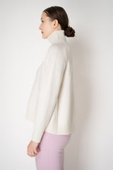Fabiana Filippi Knit Merino Wool Cropped Front Turtleneck Sweater in Off-White Vancouver. Shop Online or in Store