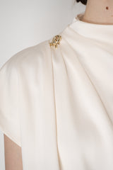Fabiana Filippi Shiny Enver Satin Draped Blouse With Knot Pin in Ivory Vancouver. Shop Online or in Store