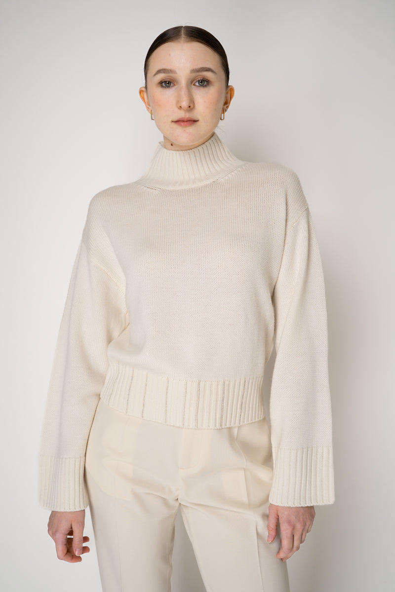 Fabiana Filippi Virgin Wool Knit Cropped Turtleneck Pullover in Ivory Vancouver. Shop Online or in Store.