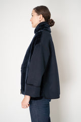 Lorena Antoniazzi High Neck Shearling Coat with Wool Sleeves in Navy Vancouver. Shop Online or in Store.