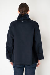 Lorena Antoniazzi High Neck Shearling Coat with Wool Sleeves in Navy Vancouver. Shop Online or in Store.