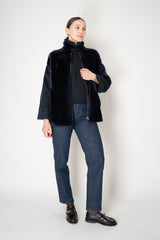 Lorena Antoniazzi High Neck Shearling Coat with Wool Sleeves in Navy Vancouver. Shop Online or in Store.