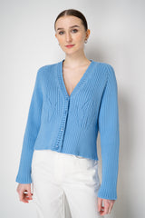 Moschino Jeans Knitted V-Neck Cardigan with Branded Logo at the Back in Blue Vancouver. Shop Online or in Store.