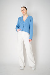 Moschino Jeans Knitted V-Neck Cardigan with Branded Logo at the Back in Blue Vancouver. Shop Online or in Store.
