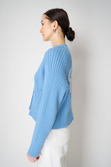 Moschino Jeans Knitted V-Neck Cardigan with Branded Logo at the Back in Blue Vancouver. Shop Online or in Store.