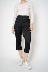 Pleats Please Issey Miyake Basics Cropped Tapered Trousers in Black Vancouver. Shop Online or in Store.