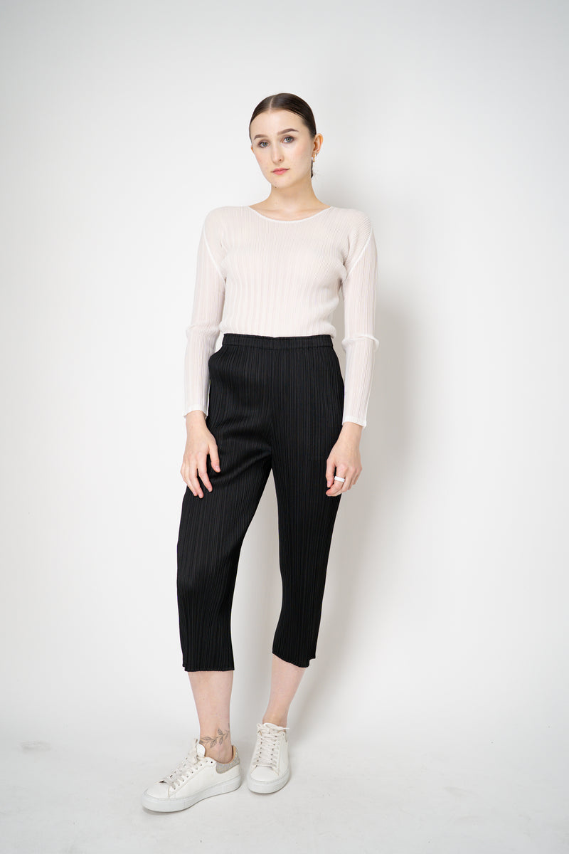 Pleats Please Issey Miyake Basics Cropped Tapered Trousers in Black Vancouver. Shop Online or in Store.