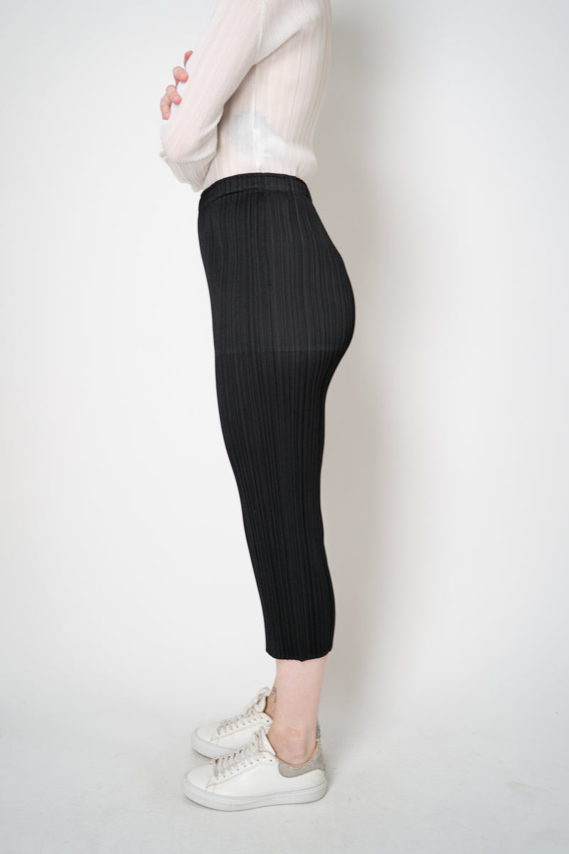 Pleats Please Issey Miyake Basics Cropped Tapered Trousers in Black Vancouver. Shop Online or in Store.