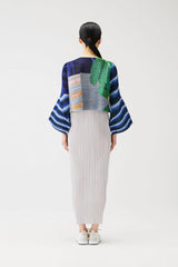 Pleats Please Issey Miyake City Collage Cropped Cardigan in Navy Blue Print Vancouver. Shop Online or in Store.