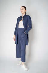 Pleats Please Issey Miyake Cotton Denim Collared Coat in Medium Blue Wash Vancouver. Shop Online or in Store.