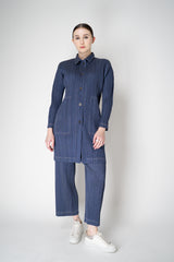Pleats Please Issey Miyake Cotton Denim Collared Coat in Medium Blue Wash Vancouver. Shop Online or in Store.