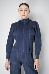Pleats Please Issey Miyake Cotton Denim Cropped Zip Jacket in Medium Blue Wash Vancouver. Shop Online or in Store.