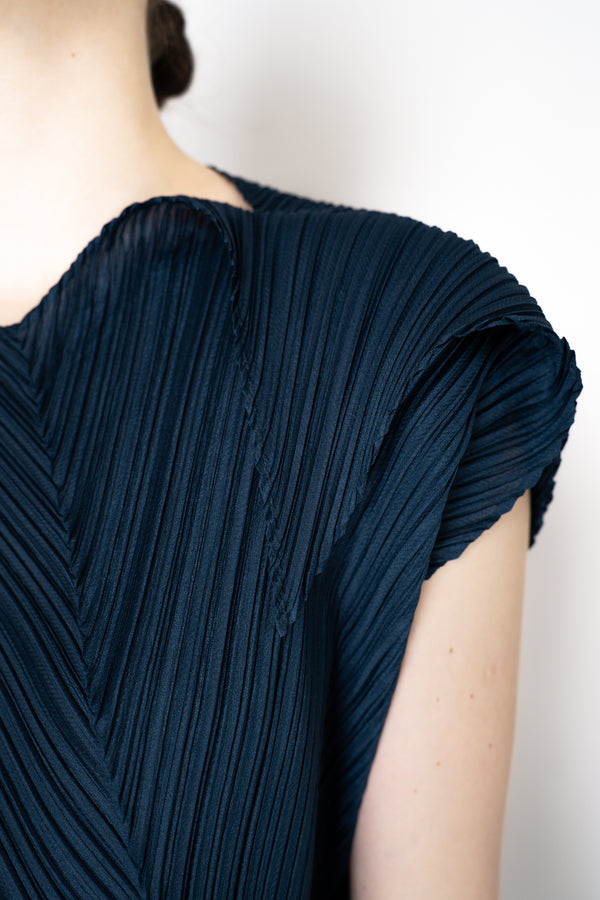 Pleats Please Issey Miyake Flare Asymmetric Top in Navy Vancouver. Shop Online or in Store.