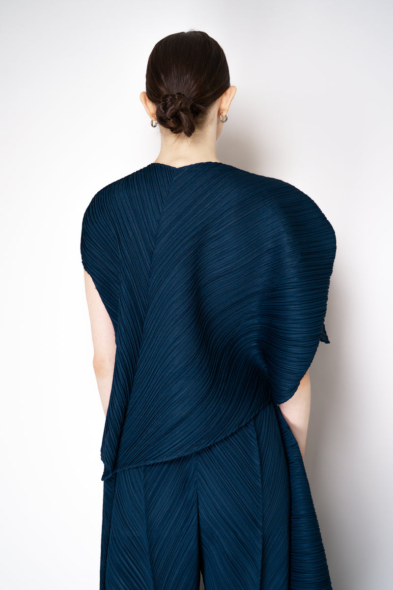 Pleats Please Issey Miyake Flare Asymmetric Top in Navy Vancouver. Shop Online or in Store.