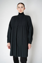 Pleats Please Issey Miyake Knee Length Smooth Coat in Charcoal Vancouver. Shop Online or in Store.