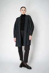 Pleats Please Issey Miyake Knee Length Smooth Coat in Charcoal Vancouver. Shop Online or in Store.