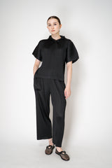 Pleats Please Issey Miyake Monthly Colors: August Hooded Short Sleeve Top in Black Vancouver. Shop Online or in Store.