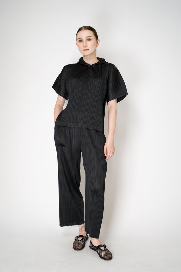 Pleats Please Issey Miyake Monthly Colors: August Hooded Short Sleeve Top in Black Vancouver. Shop Online or in Store.