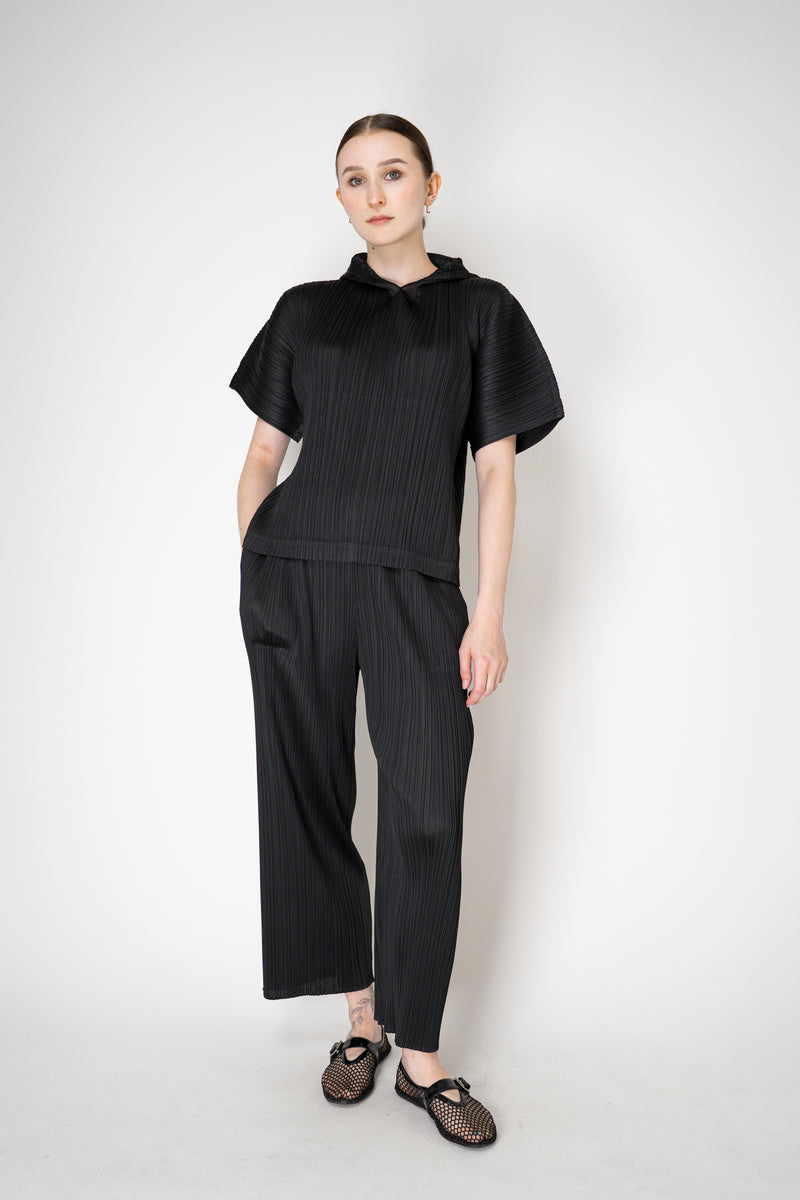 Pleats Please Issey Miyake Monthly Colors: August Hooded Short Sleeve Top in Black Vancouver. Shop Online or in Store.