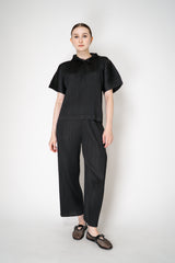 Pleats Please Issey Miyake Monthly Colors: August Hooded Short Sleeve Top in Black Vancouver. Shop Online or in Store.