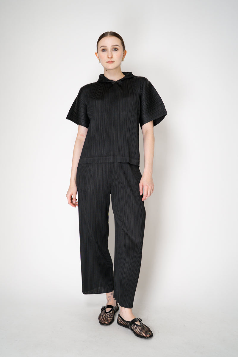 Pleats Please Issey Miyake Monthly Colors: August Hooded Short Sleeve Top in Black Vancouver. Shop Online or in Store.