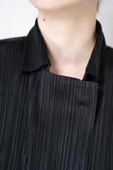 Pleats Please Issey Miyake Monthly Colors: February Collared Coat in Black Vancouver. Shop Online or in Store.